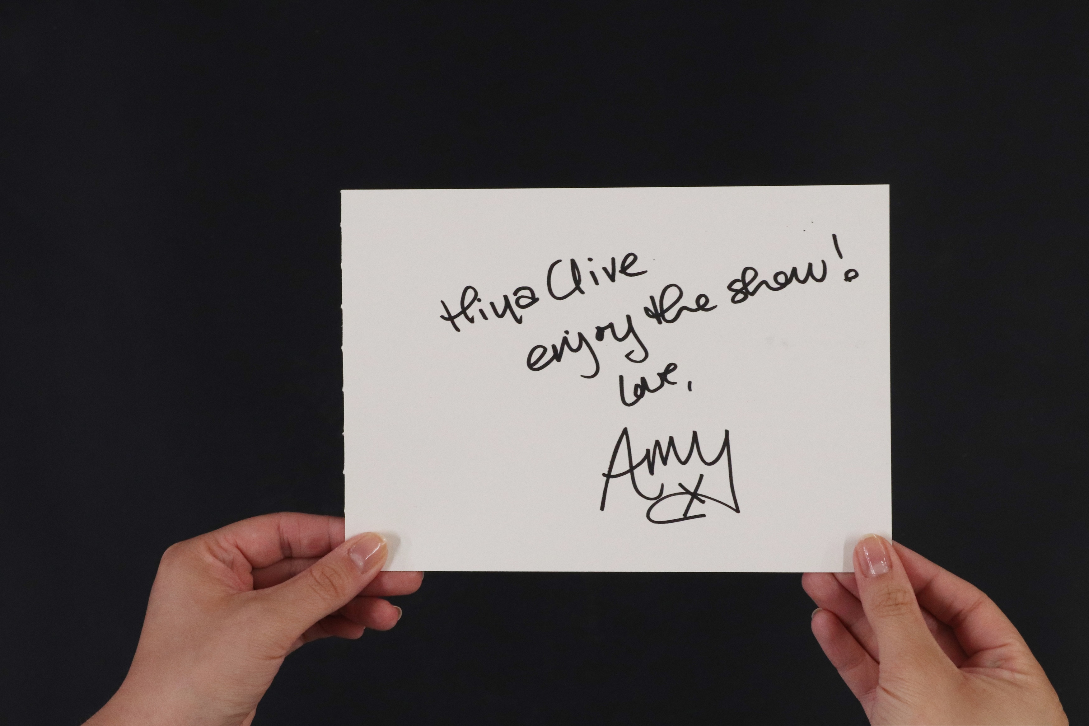 Amy Winehouse autograph, 'Hiya Clive enjoy the show! Love Amy x', on large white album page, 15 x 21cm (£500-800)